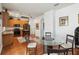 Open-concept space showcasing the kitchen with its wooden cabinets, refrigerator, and the dining area at 5235 Keenes Pheasant Dr, Windermere, FL 34786