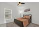 Bedroom featuring a bed, window with blinds and a ceiling fan at 555 Jett Ln, Davenport, FL 33837