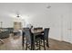 Dining area with table seating for four, open to the living area, and featuring tile floors at 555 Jett Ln, Davenport, FL 33837