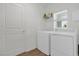 Laundry room with new white washer and dryer at 555 Jett Ln, Davenport, FL 33837