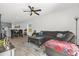 Open concept living room and dining area with neutral colors and plenty of natural light at 555 Jett Ln, Davenport, FL 33837