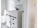 Updated bathroom with modern vanity, black hardware, and decorative tile flooring at 5607 Spring Run Ave, Orlando, FL 32819