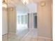 Hallway featuring a large mirror and view into the living room at 5607 Spring Run Ave, Orlando, FL 32819