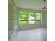 Open living room with bright windows and custom built-in shelving at 5607 Spring Run Ave, Orlando, FL 32819