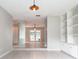 View of living room with tile floors, built-in shelves, and french doors at 5607 Spring Run Ave, Orlando, FL 32819