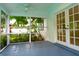 Enclosed porch with screened windows and views of the landscaped yard at 5607 Spring Run Ave, Orlando, FL 32819