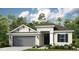 Charming single-story home featuring a two-car garage, neutral stucco, and a welcoming front entrance at 561 Moon Shell Cir, New Smyrna Beach, FL 32168