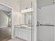 Bathroom with a glass enclosed shower, vanity, marble countertops, and views of the bedroom at 632 Bridge Creek Blvd, Ocoee, FL 34761