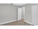 Bedroom featuring closet and doorway, completed with gray walls and wood-look flooring at 632 Bridge Creek Blvd, Ocoee, FL 34761