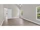 The main bedroom features wood-look floors, neutral walls, and a ceiling fan at 632 Bridge Creek Blvd, Ocoee, FL 34761