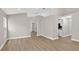 Spacious living room with hardwood floors and neutral walls, leading to other rooms at 632 Bridge Creek Blvd, Ocoee, FL 34761