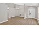 Bright and open-concept living room with wood-look floors and a chandelier at 632 Bridge Creek Blvd, Ocoee, FL 34761
