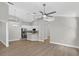 Open-concept living space featuring vaulted ceilings, stylish flooring, and modern lighting fixtures at 632 Bridge Creek Blvd, Ocoee, FL 34761