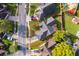 Aerial view of a property with a well-maintained lawn and mature trees, within a defined boundary at 6512 Grosvenor Ln, Orlando, FL 32835