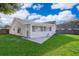 Enjoy a well-maintained backyard, featuring a screened-in porch and a pristine lawn at 6512 Grosvenor Ln, Orlando, FL 32835