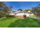Charming single-Gathering home with a well-maintained lawn and landscaping and an attached two-car garage at 6512 Grosvenor Ln, Orlando, FL 32835
