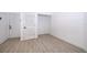Open living room with wood floors and neutral colors provide an empty canvas that is welcoming and spacious at 6512 Grosvenor Ln, Orlando, FL 32835