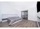 Large bedroom with wood flooring, recessed lighting, and sliding glass doors opening to a balcony or patio at 6512 Grosvenor Ln, Orlando, FL 32835