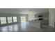 Bright living space with large windows and an open view to the kitchen at 680 Sand Pine Ln, Haines City, FL 33844