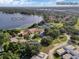 Aerial view of the community featuring Lake Marsha, a clubhouse with a pool and tennis courts, and views of Downtown Orlando at 6836 Bittersweet Ln, Orlando, FL 32819