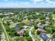 Aerial view of the neighborhood with golf course and water tower at 6836 Bittersweet Ln, Orlando, FL 32819