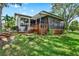 Inviting backyard with a spacious deck and screened-in lanai, perfect for outdoor relaxation and entertaining at 6836 Bittersweet Ln, Orlando, FL 32819