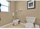 This bathroom has a toilet, bidet, and window with natural light, offering a spa-like experience at 6836 Bittersweet Ln, Orlando, FL 32819