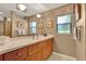 Bathroom features granite counters, modern fixtures, and large windows for ample light at 6836 Bittersweet Ln, Orlando, FL 32819
