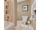 Bright bathroom featuring a soaking tub with tiled shower, tiled floor, and neutral wall paint at 6836 Bittersweet Ln, Orlando, FL 32819