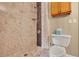 Tiled walk-in shower and toilet offers a modern and functional bathroom space at 6836 Bittersweet Ln, Orlando, FL 32819