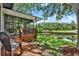 Wooden deck and screened in porch overlooking pond and green space at 6836 Bittersweet Ln, Orlando, FL 32819