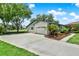 Exterior shows an attached garage, stone accents, and landscaping at 6836 Bittersweet Ln, Orlando, FL 32819