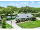 Beautiful home with mature trees, well-manicured lawn and landscaping on a beautiful lot with golf course views at 6836 Bittersweet Ln, Orlando, FL 32819