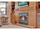 Living room fireplace with detailed wooden mantle and stone base; built-in bookcases at 6836 Bittersweet Ln, Orlando, FL 32819
