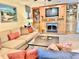 Comfortable living room featuring a fireplace, shelving and a neutral color palette at 6836 Bittersweet Ln, Orlando, FL 32819
