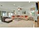 Spacious living room with an open floor plan, lots of natural light, and stylish furnishings at 6836 Bittersweet Ln, Orlando, FL 32819