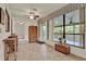 Cozy sunroom with tile flooring, large windows, and comfortable furniture with views of the outdoors at 6836 Bittersweet Ln, Orlando, FL 32819