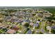 Real estate aerial view showcasing the layout and design of a suburban neighborhood with many homes at 8152 Fan Palm Way, Kissimmee, FL 34747