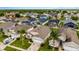 Aerial view of a single-story home with a two-car garage and enclosed pool in a vibrant community with well-kept lawns at 8152 Fan Palm Way, Kissimmee, FL 34747