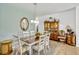Dining room showcasing light walls, a decorative mirror, and a vintage china cabinet at 8152 Fan Palm Way, Kissimmee, FL 34747