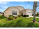 Charming single-story home with well-maintained lawn and front yard landscaping at 8152 Fan Palm Way, Kissimmee, FL 34747
