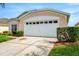This home features a convenient two car garage with an automatic door at 8152 Fan Palm Way, Kissimmee, FL 34747