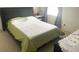 Bedroom showcasing a bed with an olive green quilt at 8206 Gemstone Ct, Orlando, FL 32836