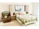 Cozy bedroom featuring a headboard with storage, and a comfortable recliner at 8206 Gemstone Ct, Orlando, FL 32836