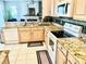 Well-equipped kitchen with tile floor, granite counters, and modern appliances at 8206 Gemstone Ct, Orlando, FL 32836