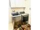 Laundry Room with front load washer and dryer at 8206 Gemstone Ct, Orlando, FL 32836