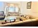 Relaxing living room with neutral colors, a swingasan, and lots of natural light at 8206 Gemstone Ct, Orlando, FL 32836
