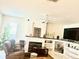 Cozy living room features a fireplace, custom built-ins, and ample natural light at 8206 Gemstone Ct, Orlando, FL 32836