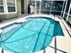 Sparkling pool featuring a screened enclosure for outdoor enjoyment and relaxation at 8206 Gemstone Ct, Orlando, FL 32836