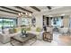 Expansive living room with stylish decor and a seamless connection to the outdoor living area at 854 Junonia Blvd, New Smyrna Beach, FL 32168